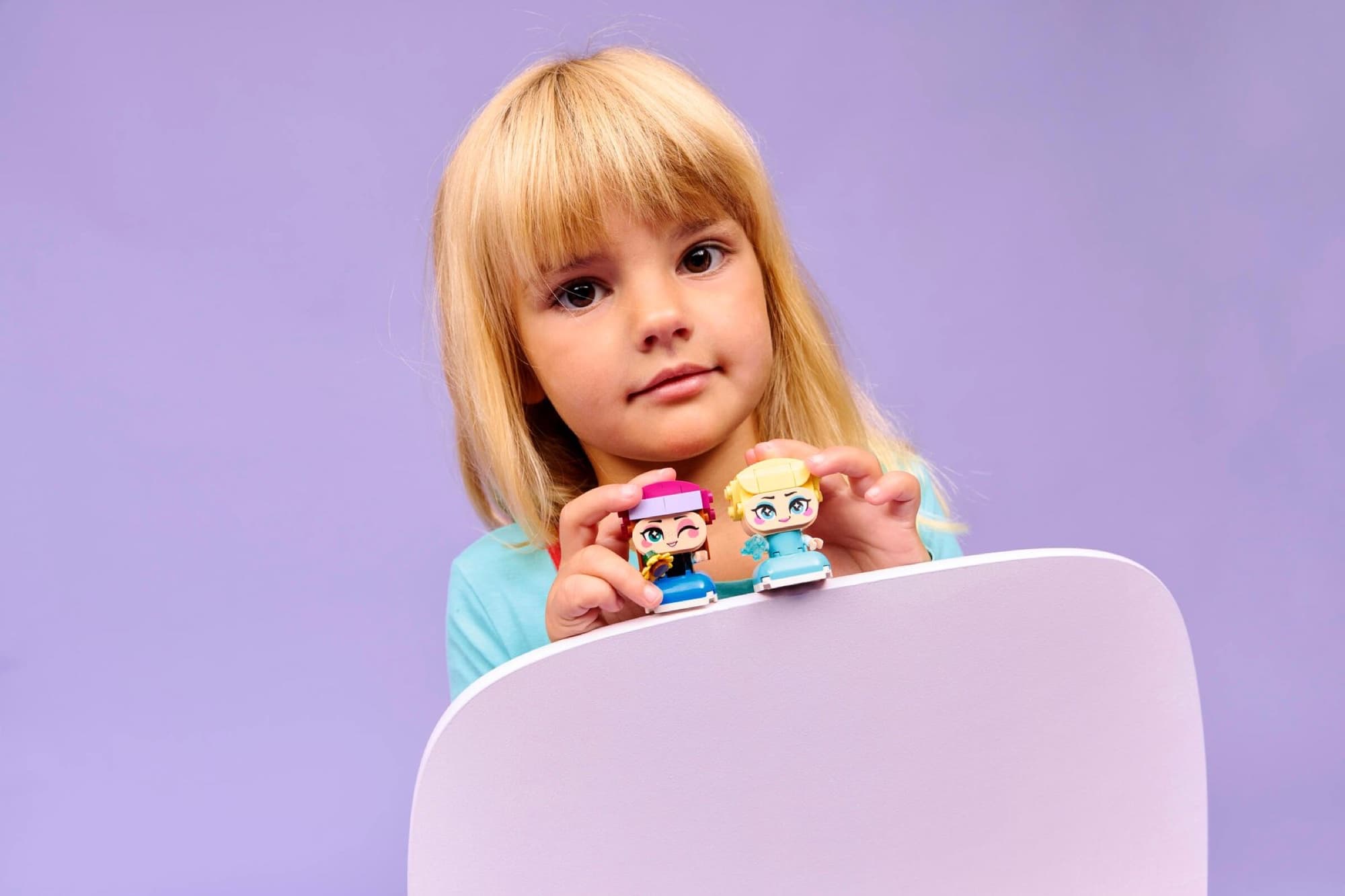 Mini Anna and Elsa being built and played with