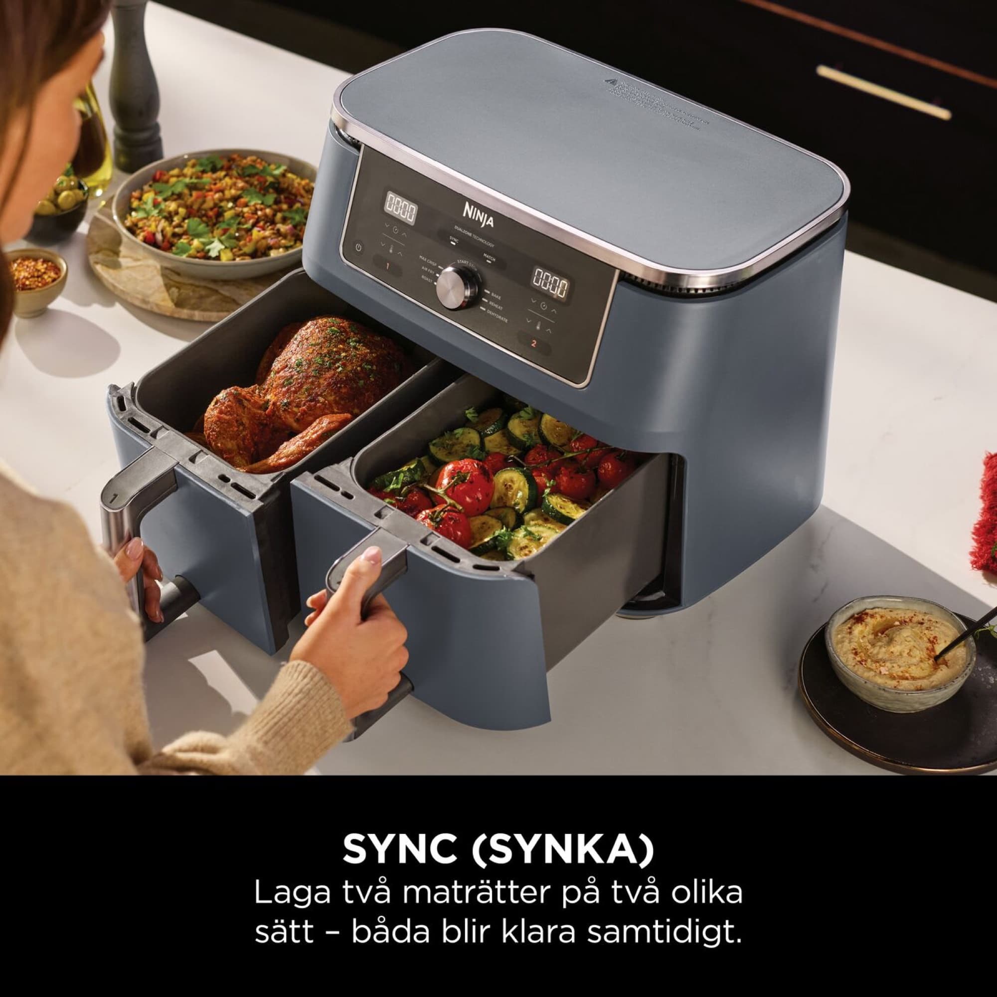 Drawers with meat and vegetables in the Cyber Space air fryer