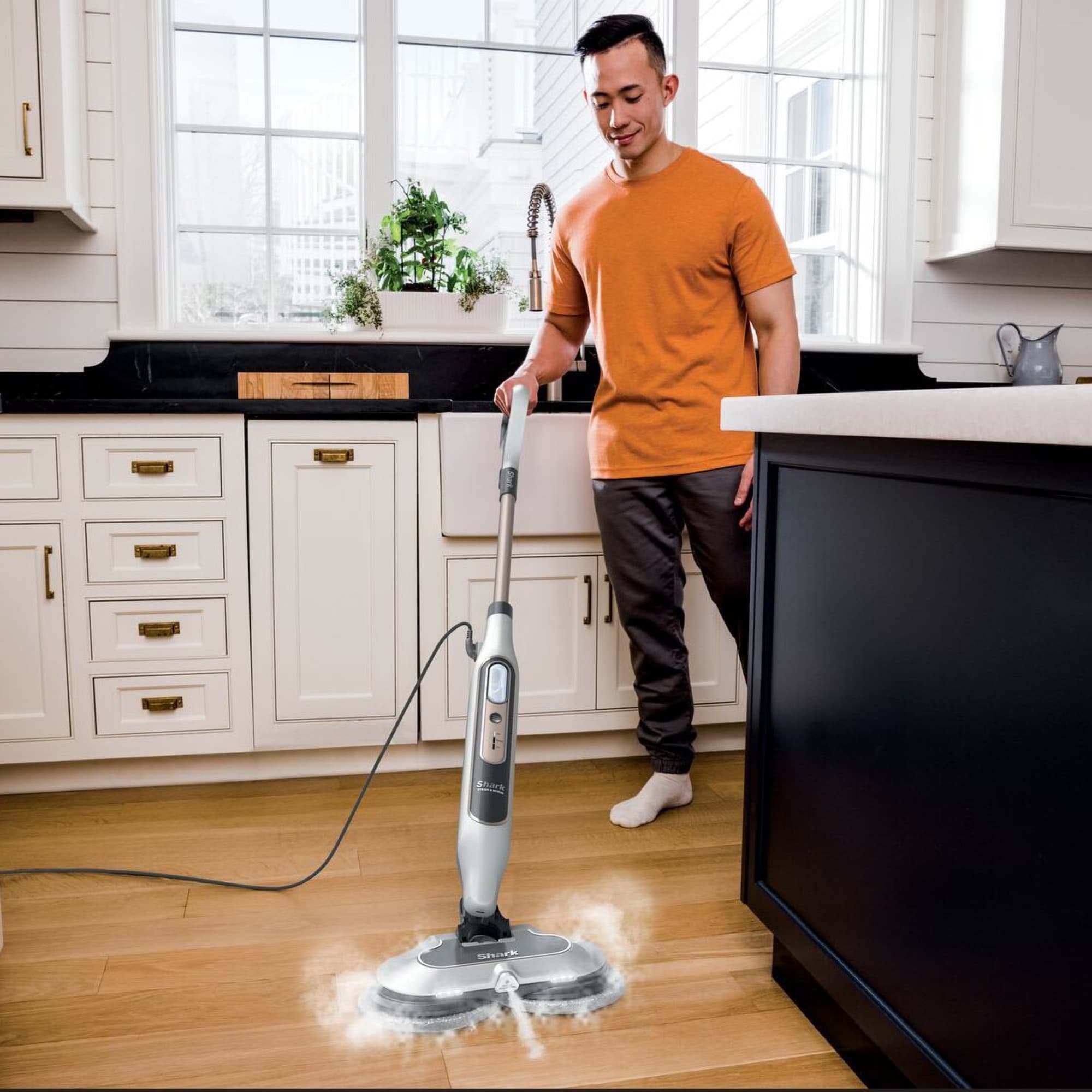 The steam mop cleaning the kitchen floor