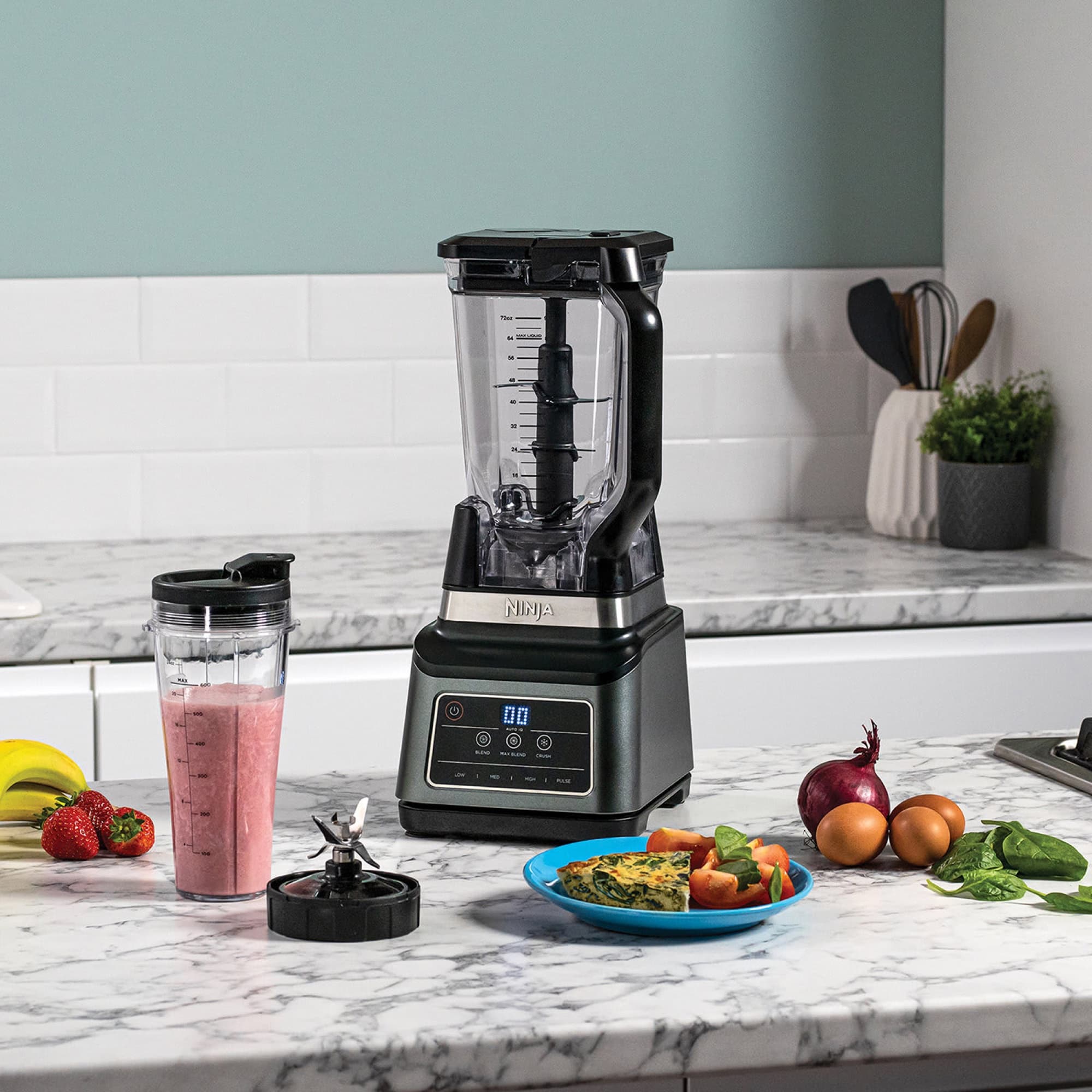 Smoothie, omelette and vegetables by the blender
