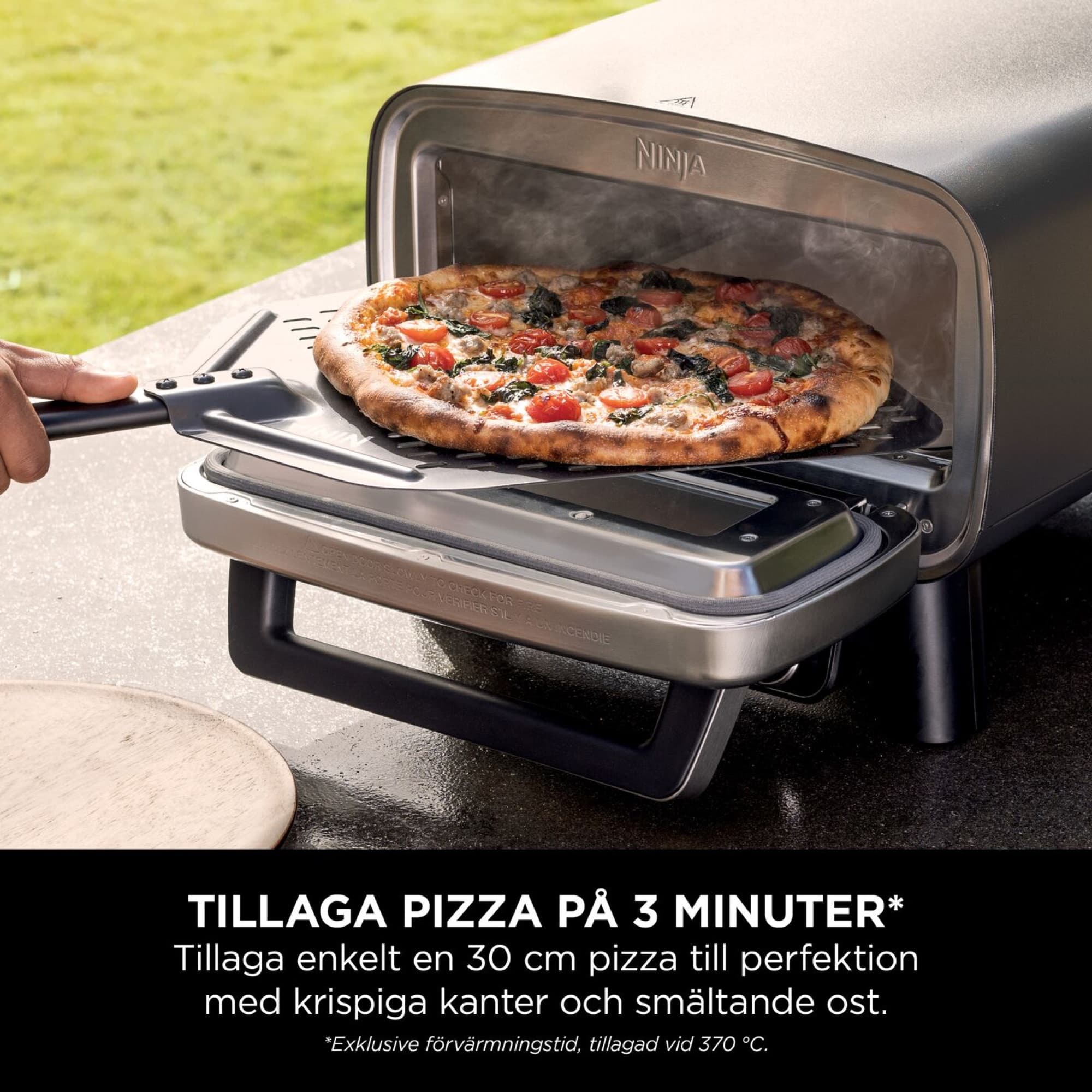 A pizza taken out with the pizza peel