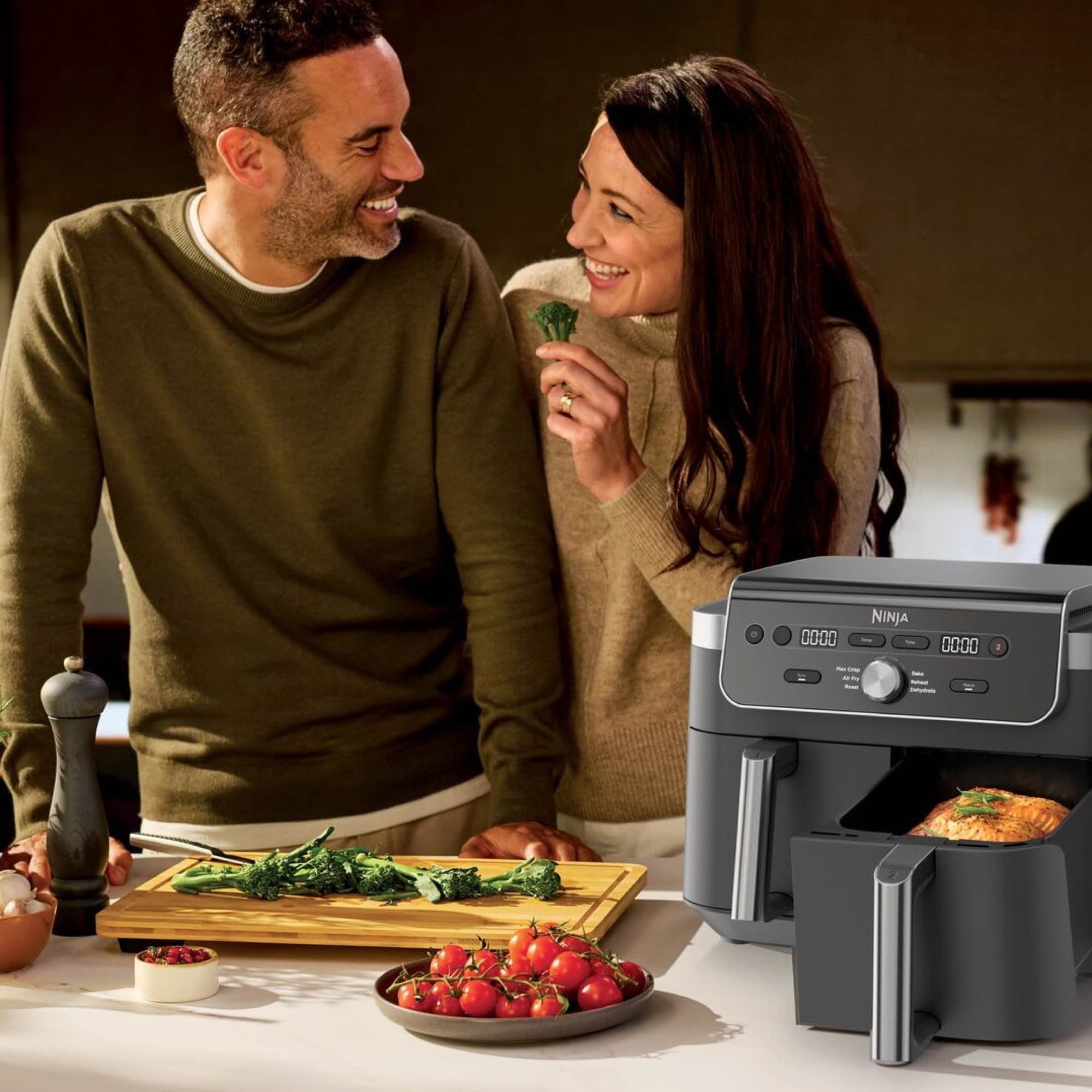 Couple cooking dinner with the air fryer