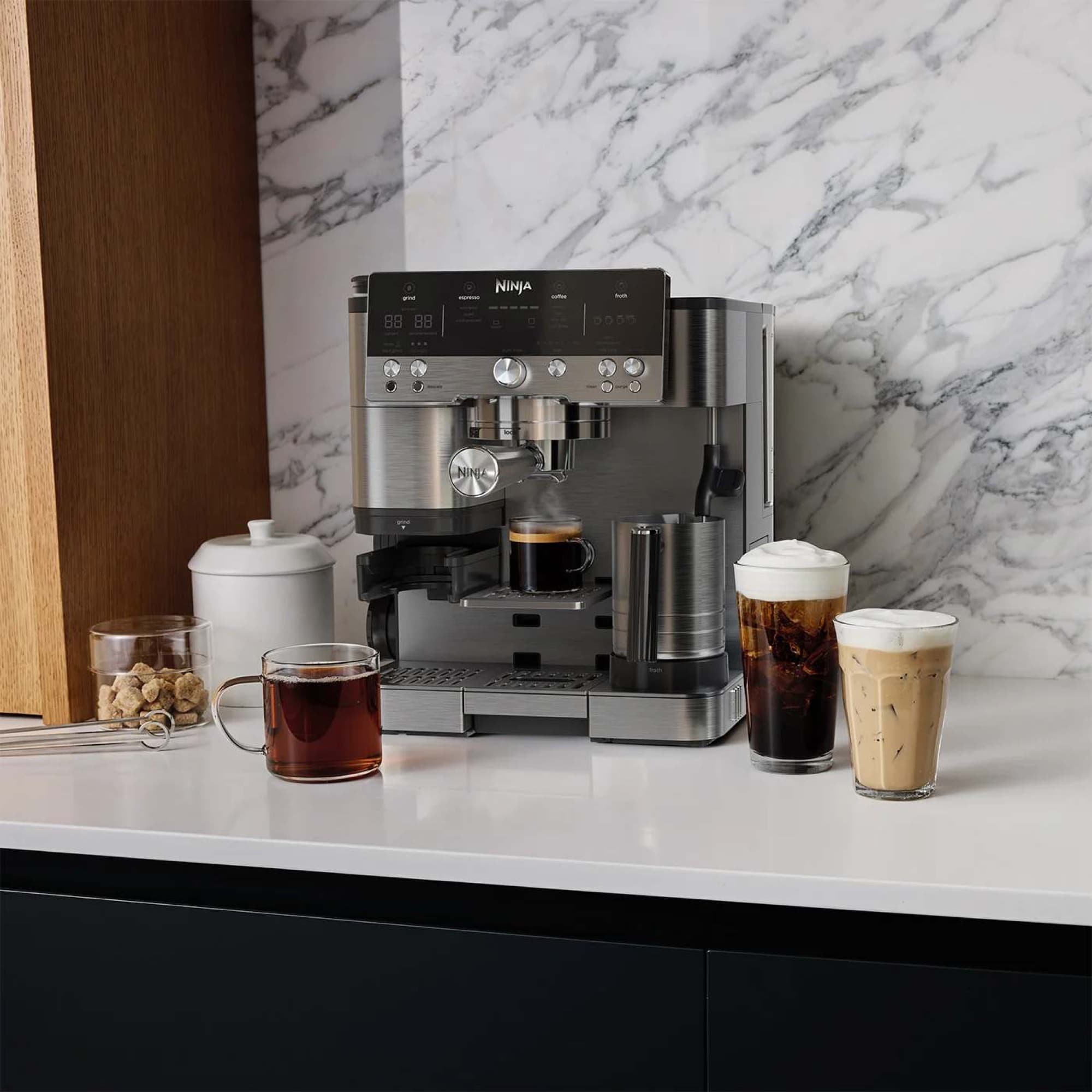 The coffee machine on the worktop with hot and cold drinks