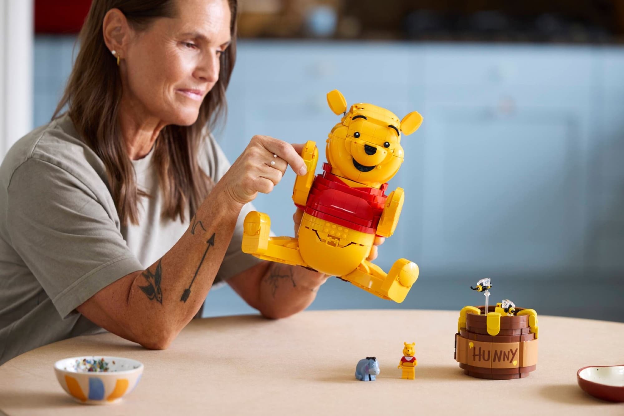 Brick-built Winnie the Pooh being built and played with