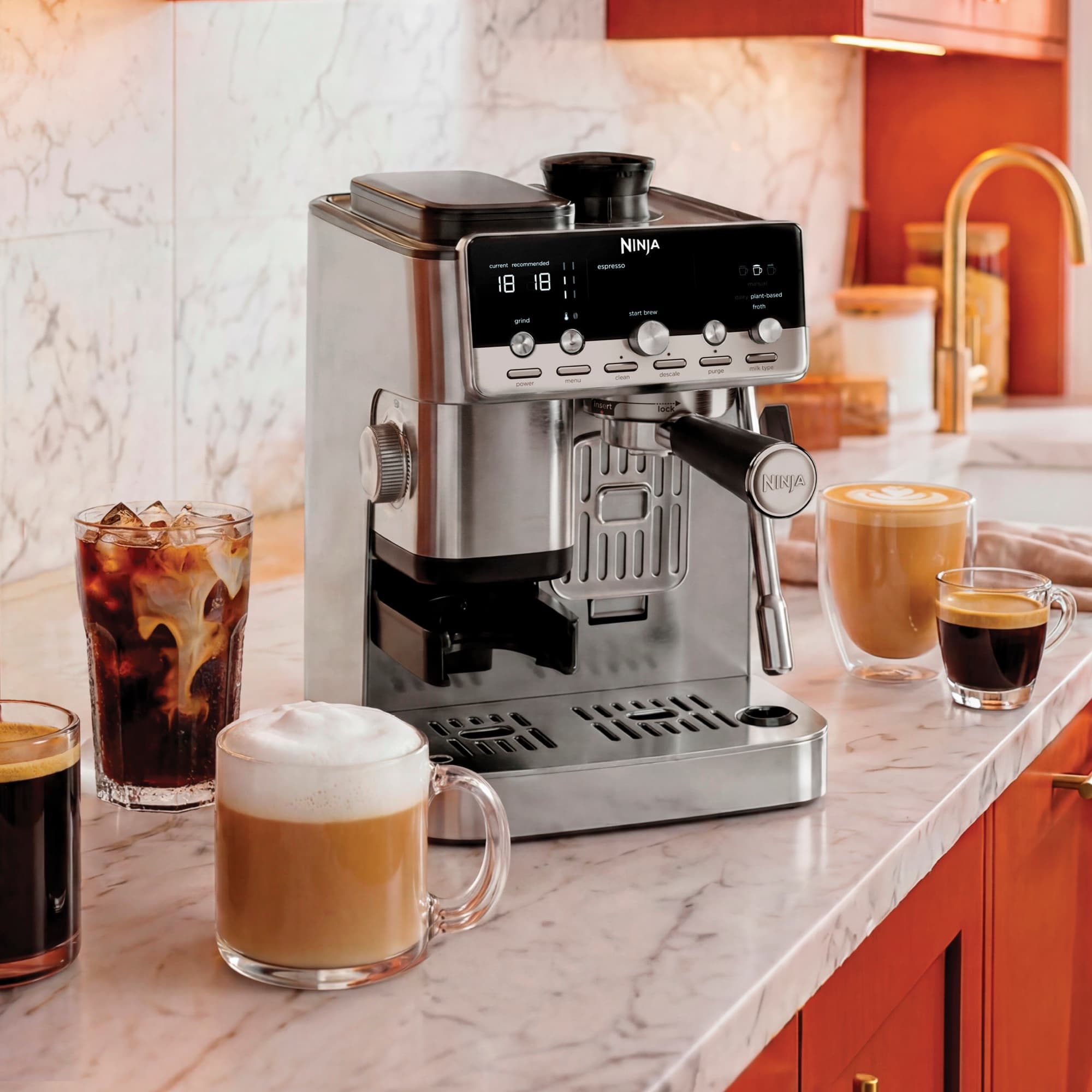 The espresso machine on a marble worktop