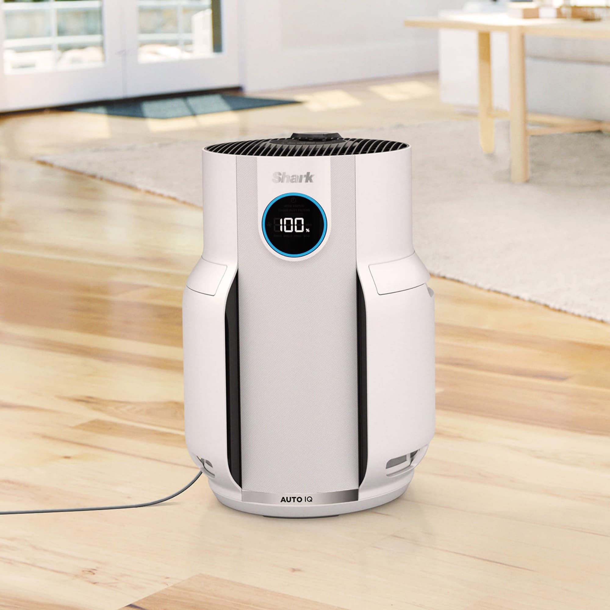 The air purifier on the living room floor
