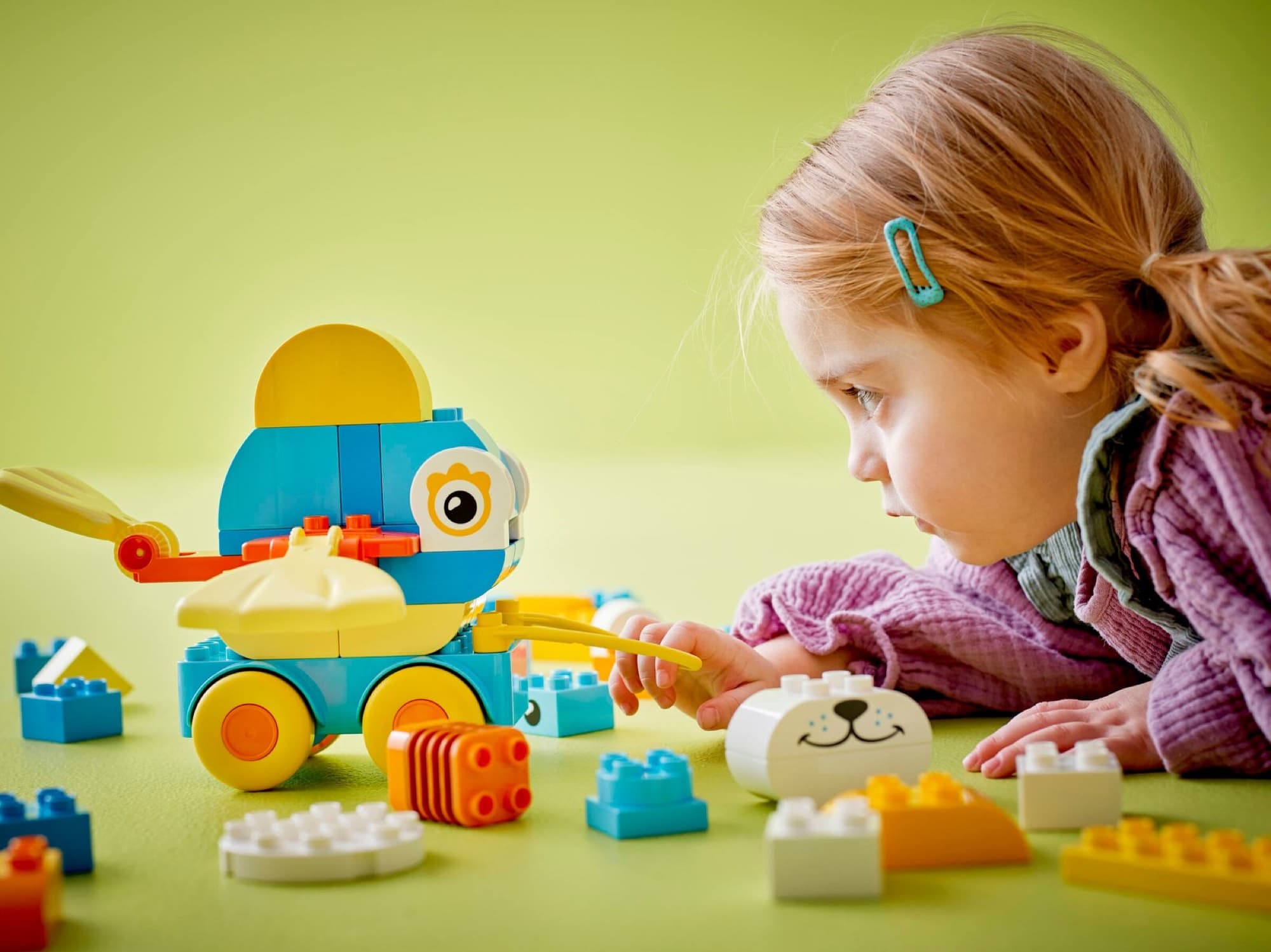 DUPLO animals on wheels being built and played with