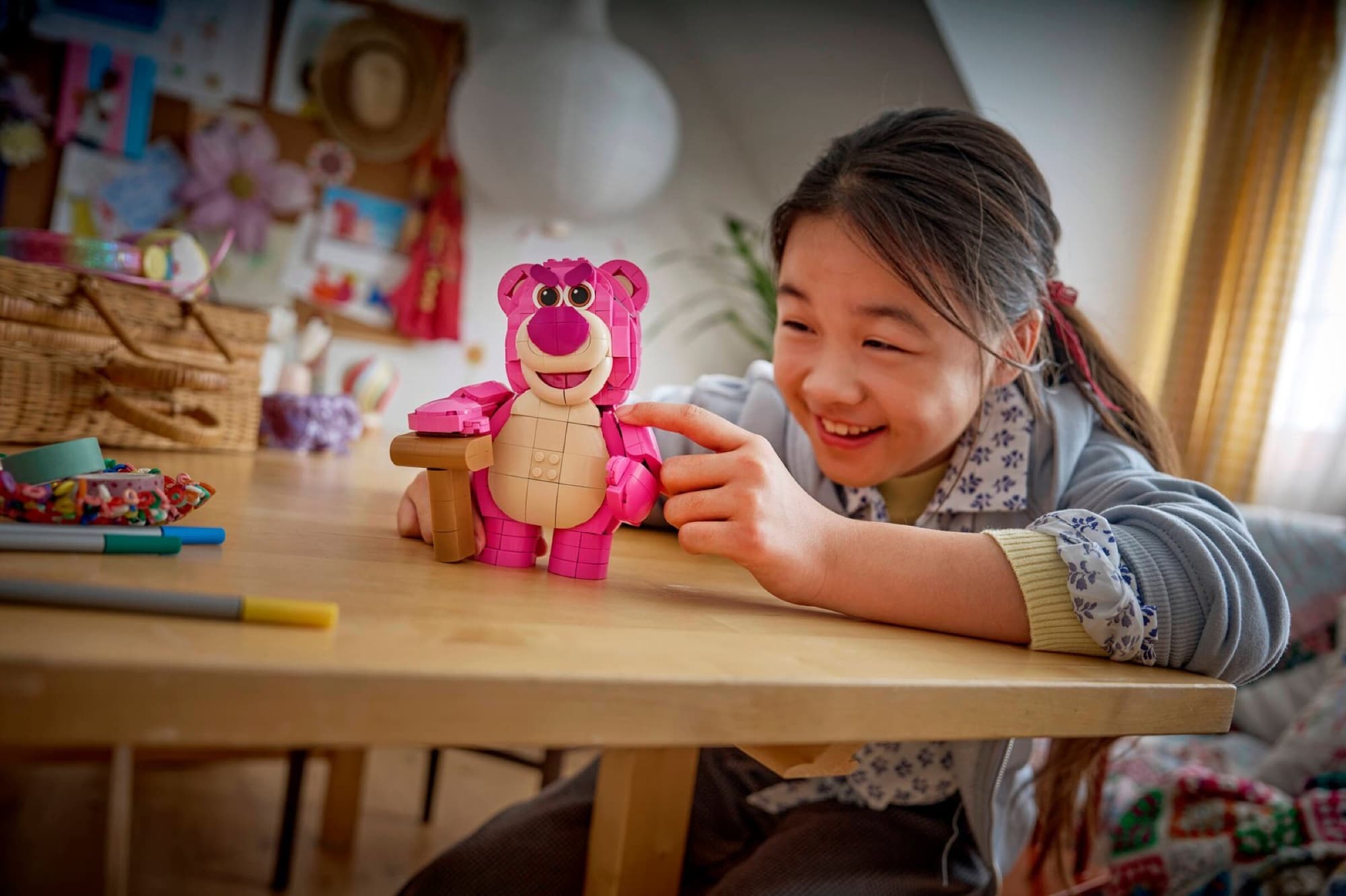 Lotso from Toy Story being built and played with