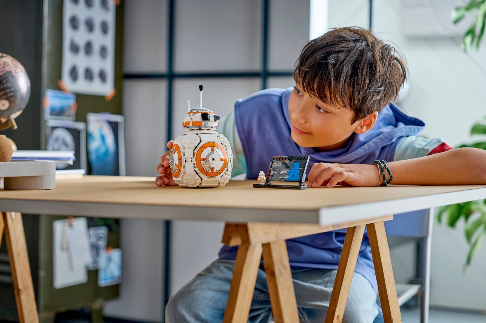 The droid BB-8 being built and played with