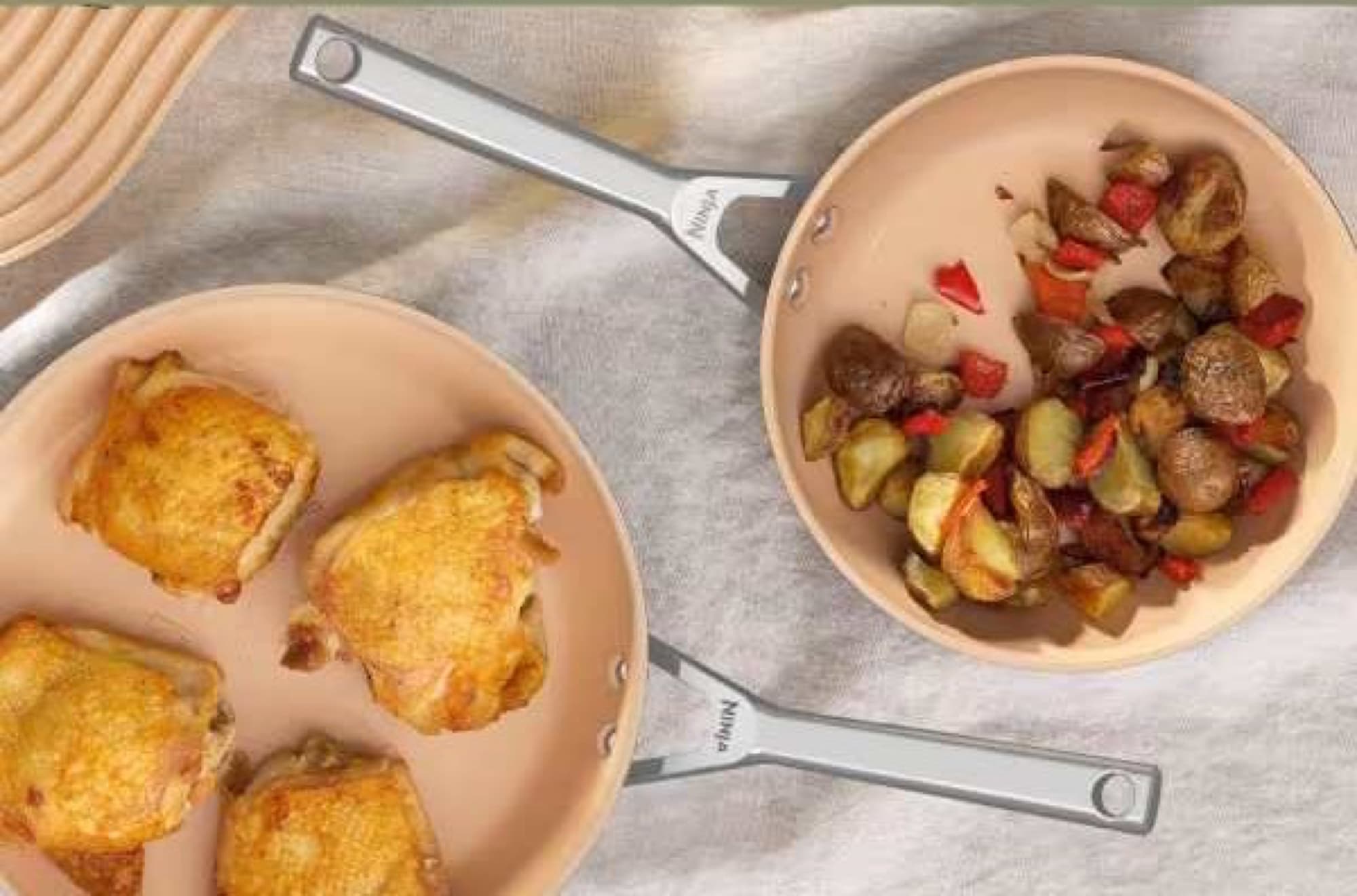 Chicken and fried potatoes in the pan