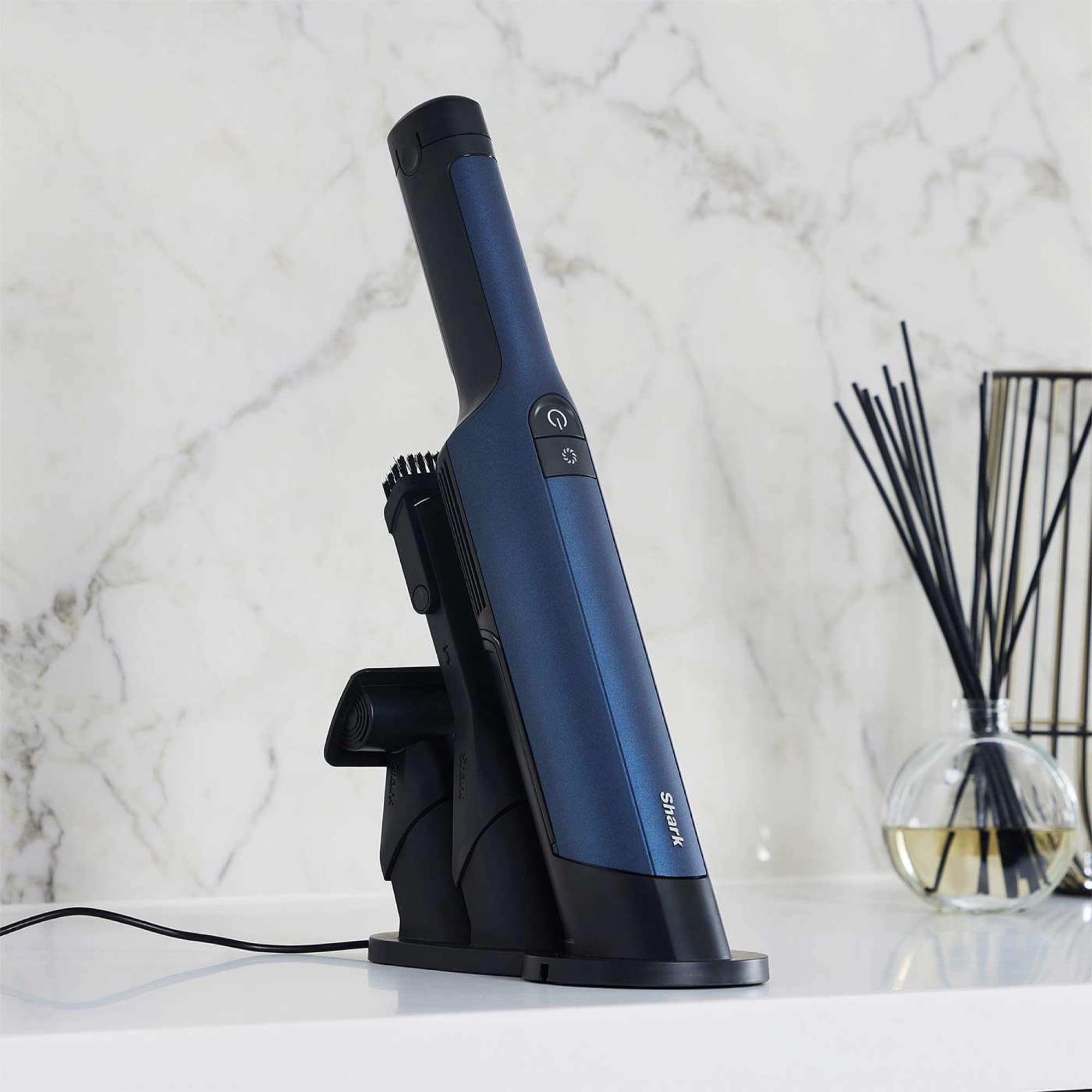 The WandVac charging on the kitchen counter