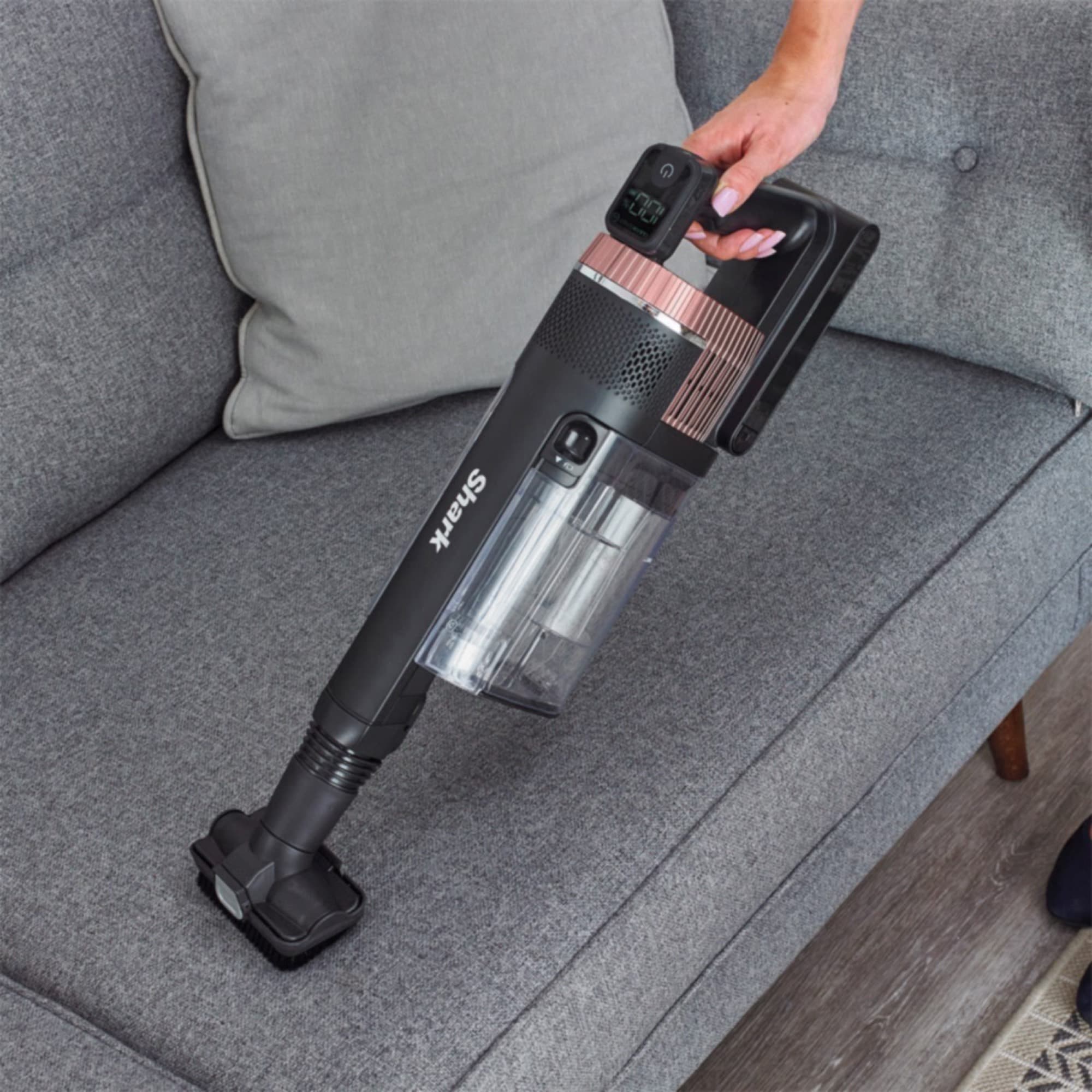 The handheld cleaning the sofa