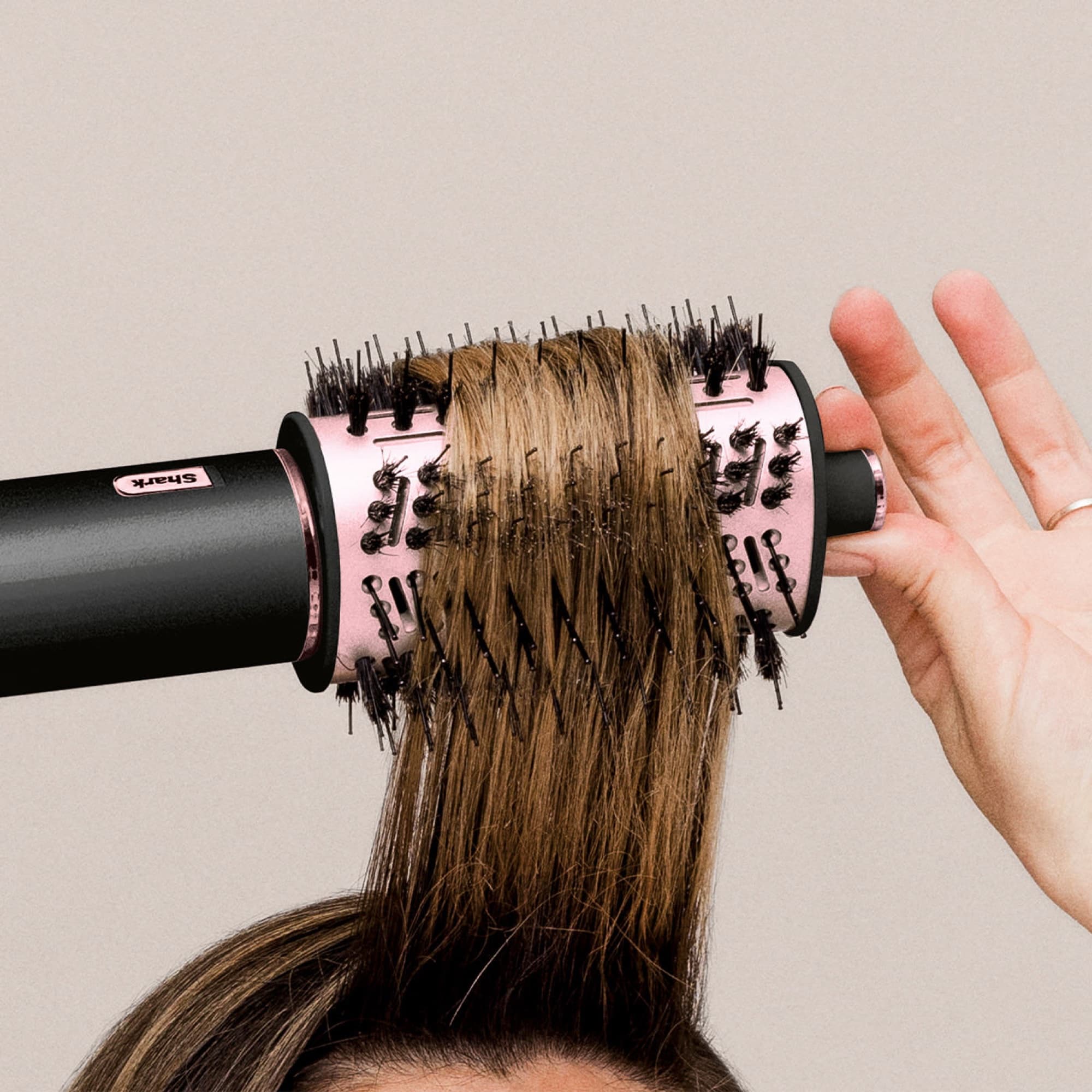 The brush rolled through the hair for volume