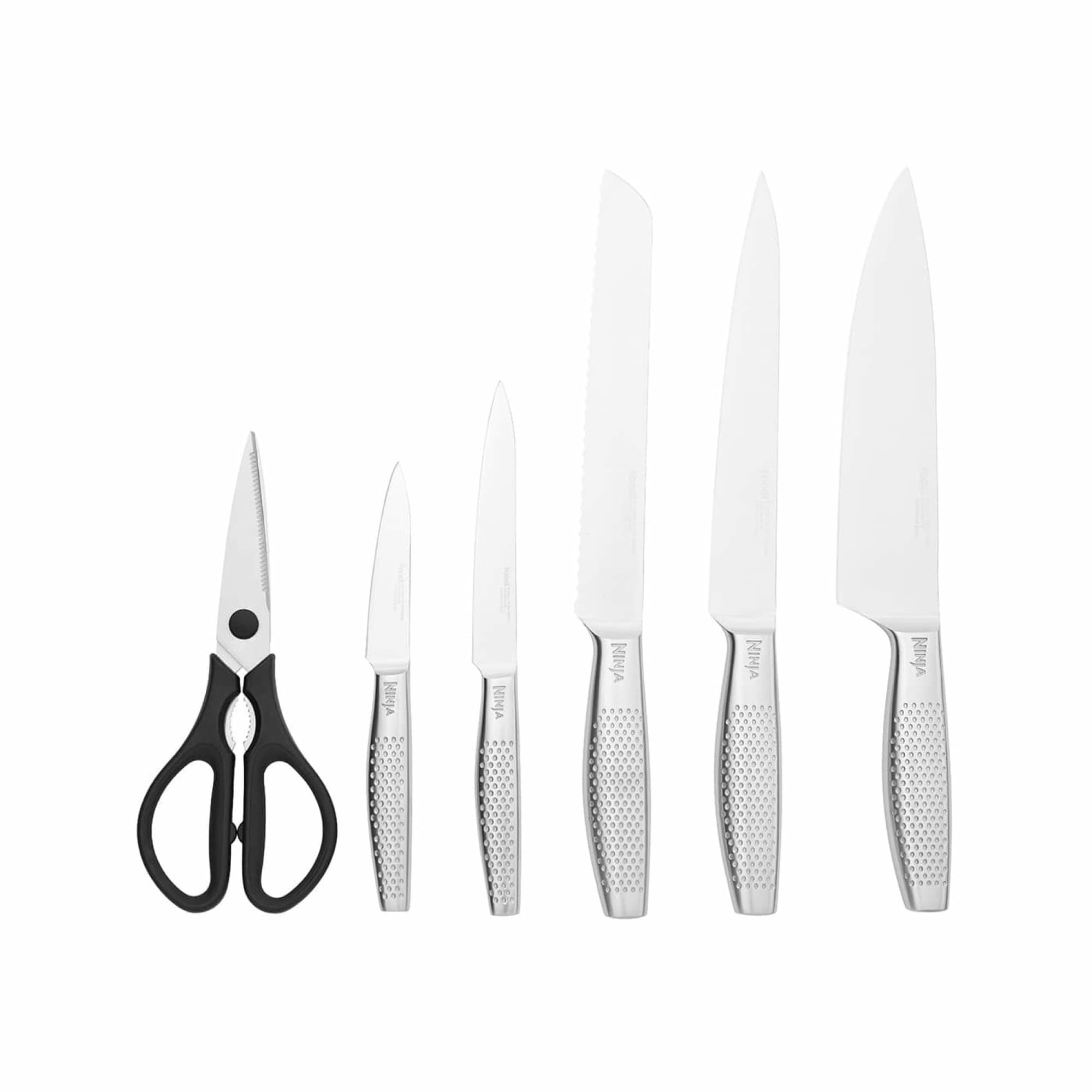 Five stainless steel knives and kitchen scissors