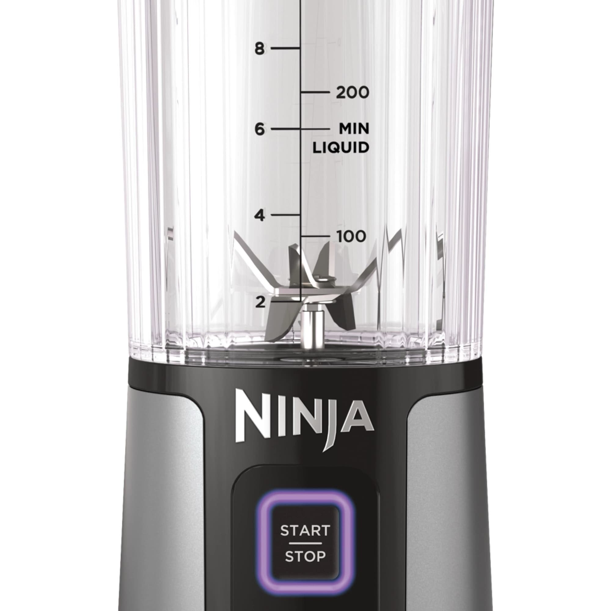 Cup with stainless steel blades and measuring scale