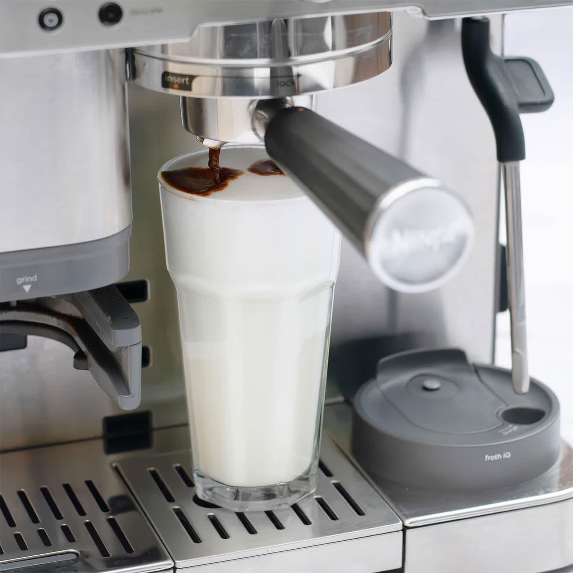 Coffee brewed into a glass of milk