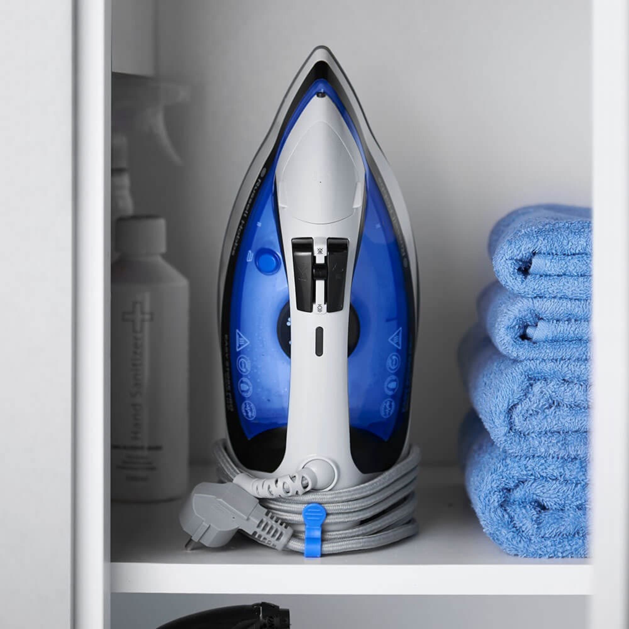 The iron stored in a cupboard