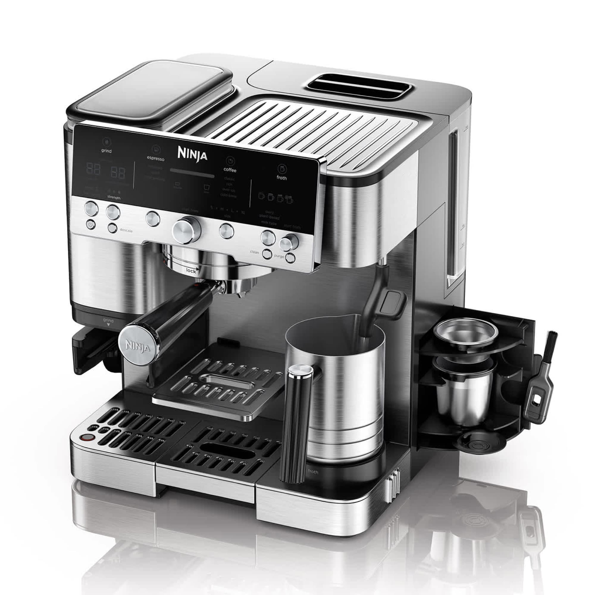 The machine from the front at an angle with froth jug and accessories