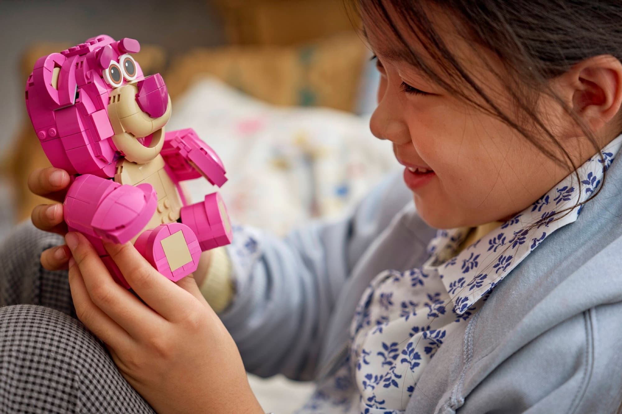 Lotso from Toy Story being built and played with