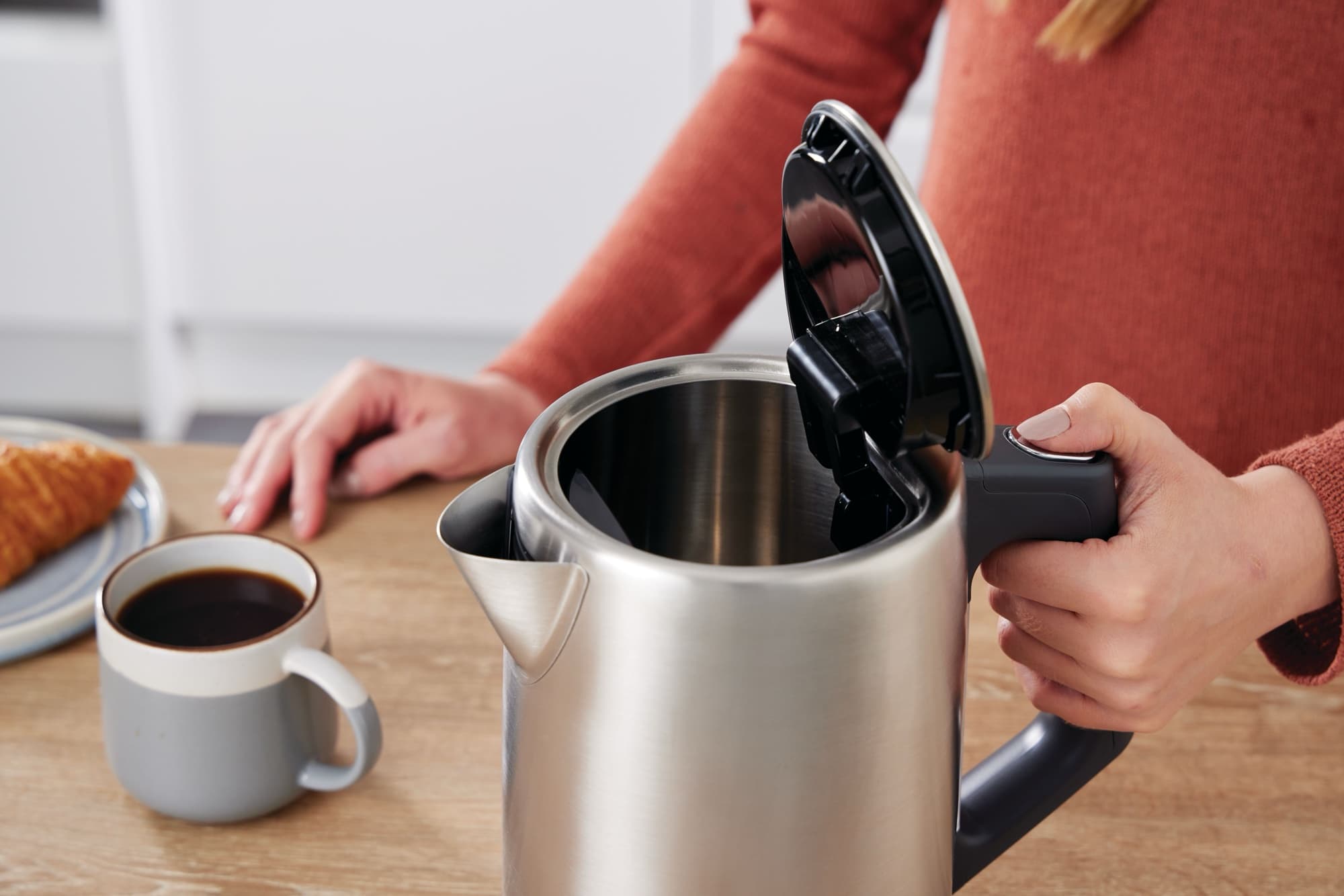 The lid opens at the press of a button