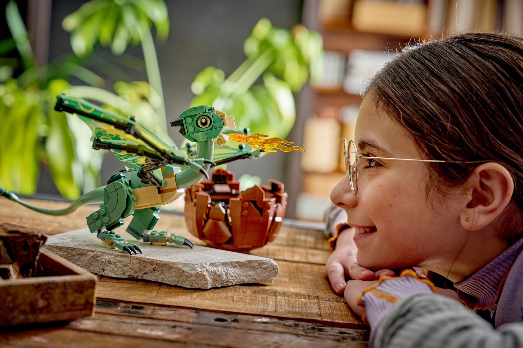 Norbert the baby dragon being built and played with