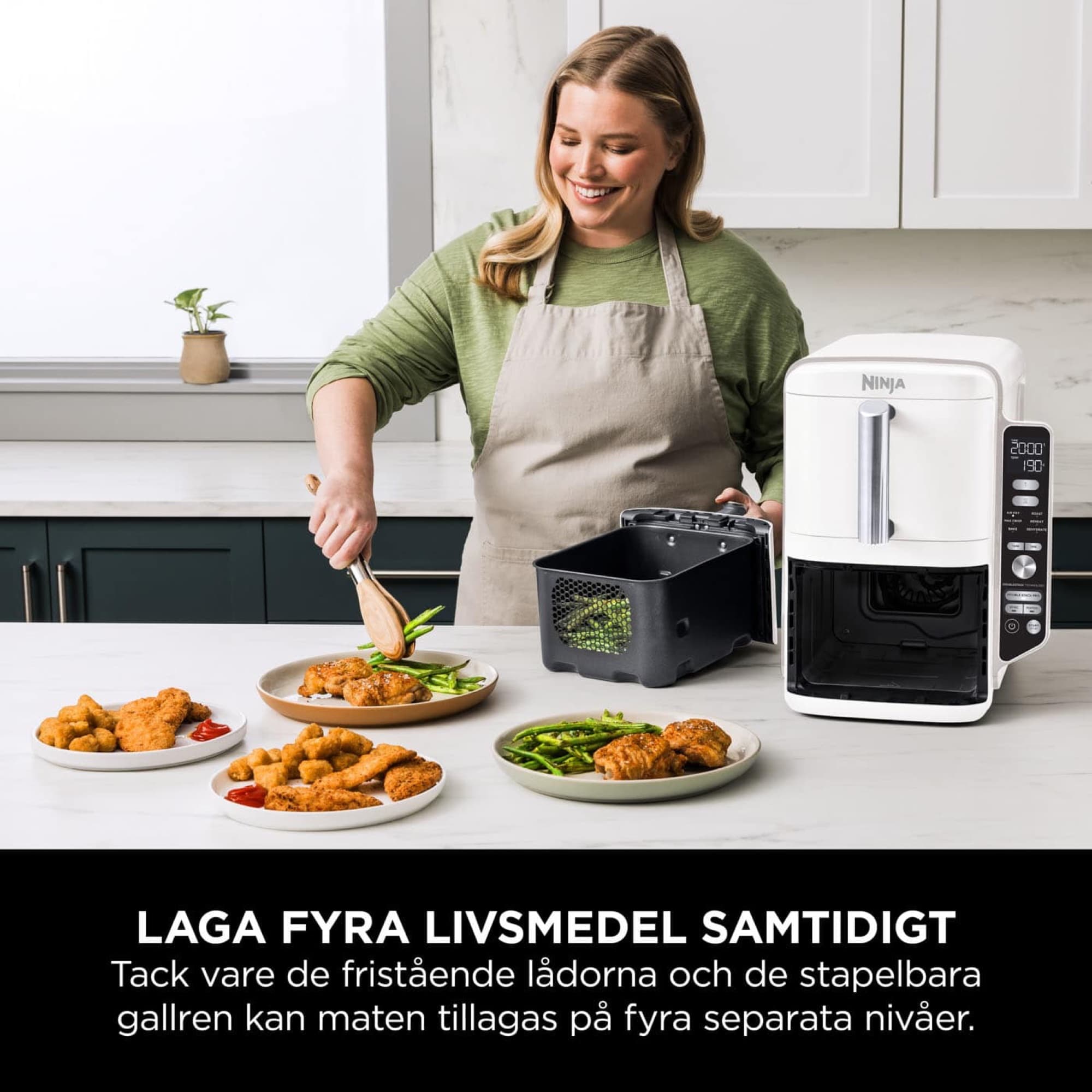 Woman cooking several dishes at once with the air fryer