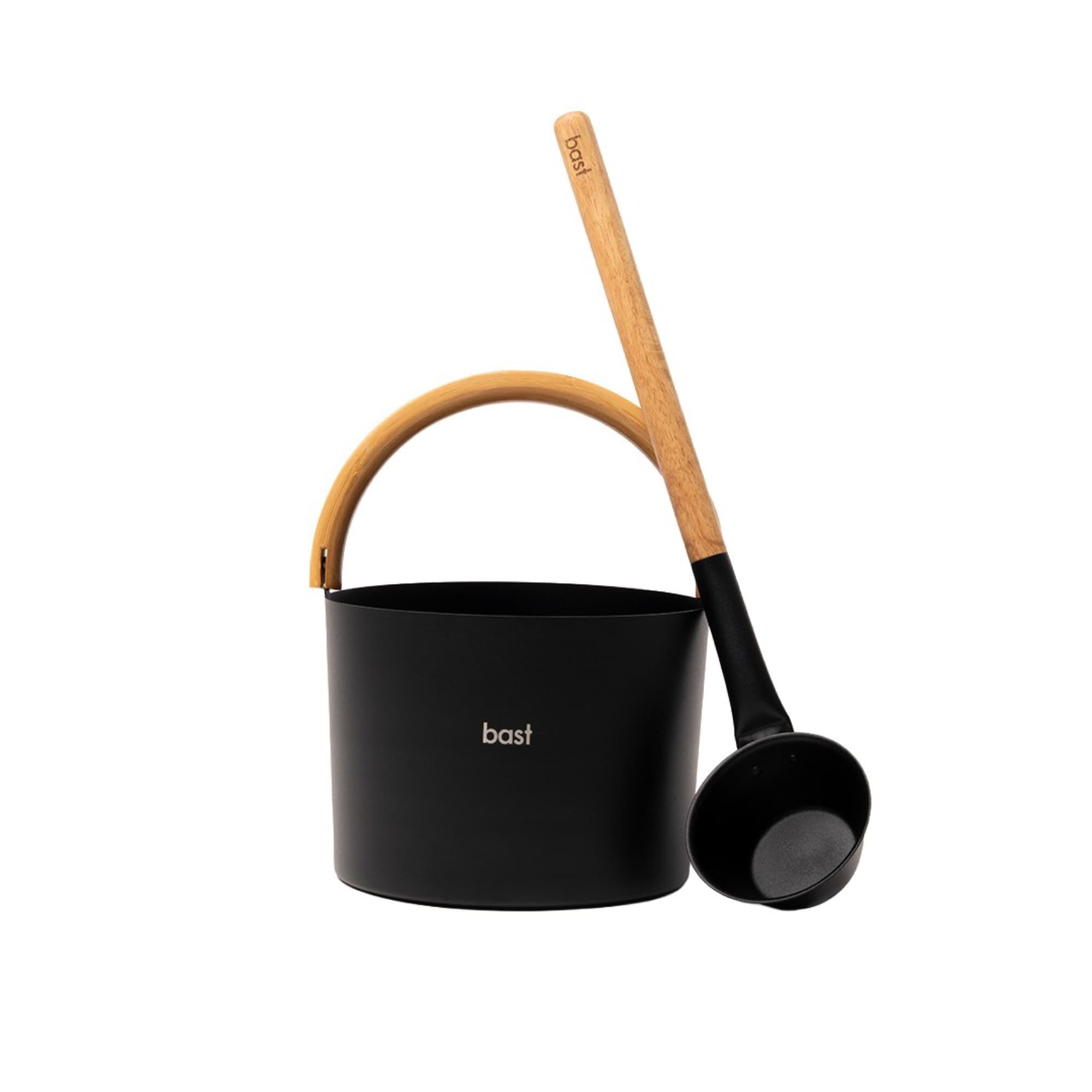 Sauna bucket and ladle on a black background