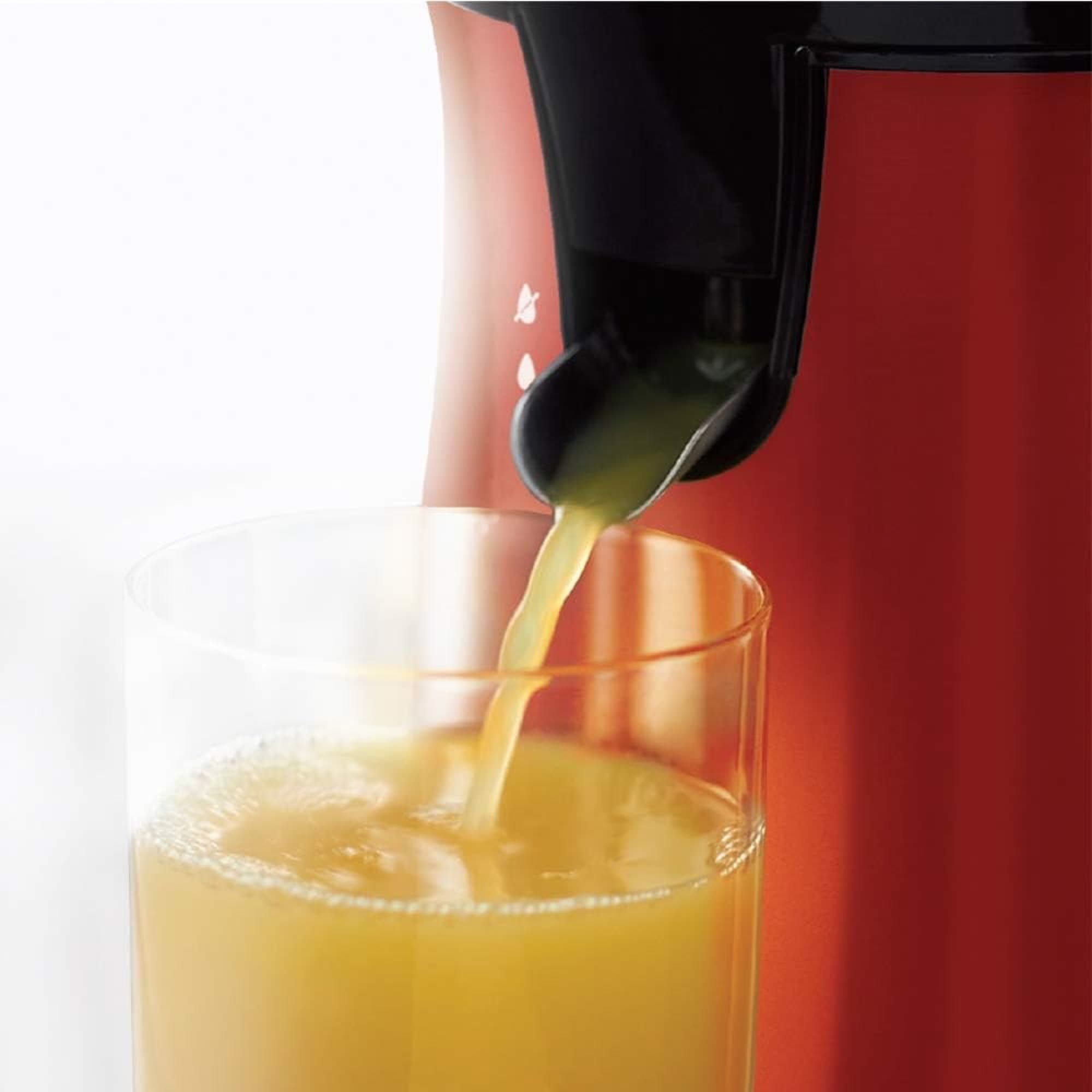 Juice pouring into the glass