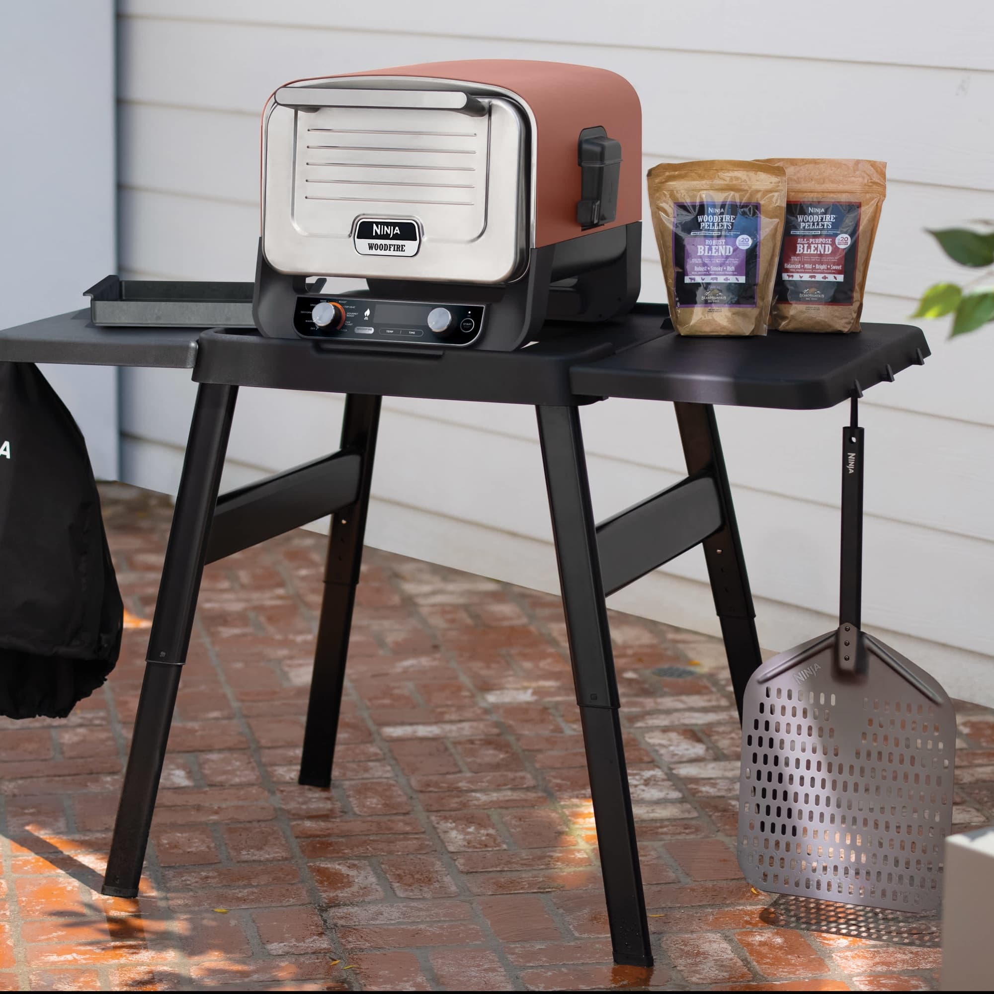 The Artisan pizza oven on the stand with side table
