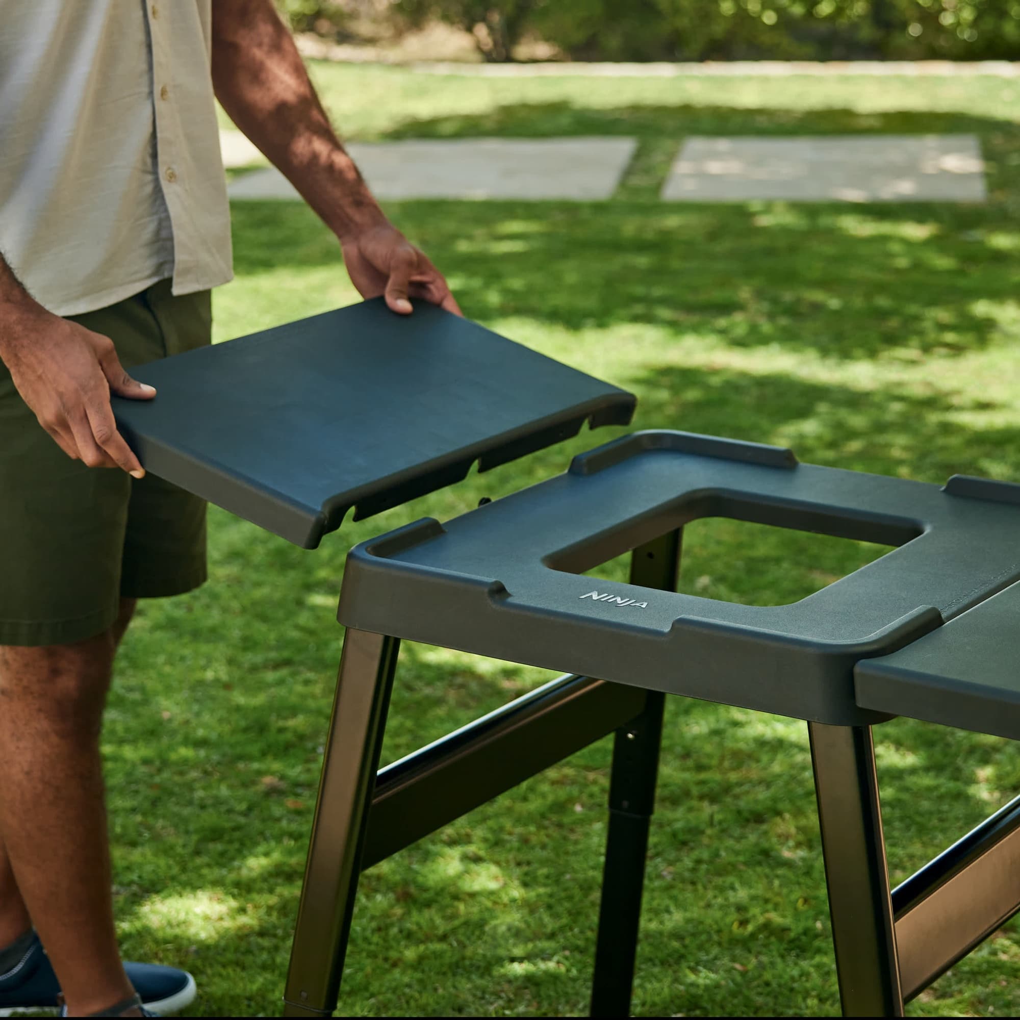 The side table being fitted to the universal stand