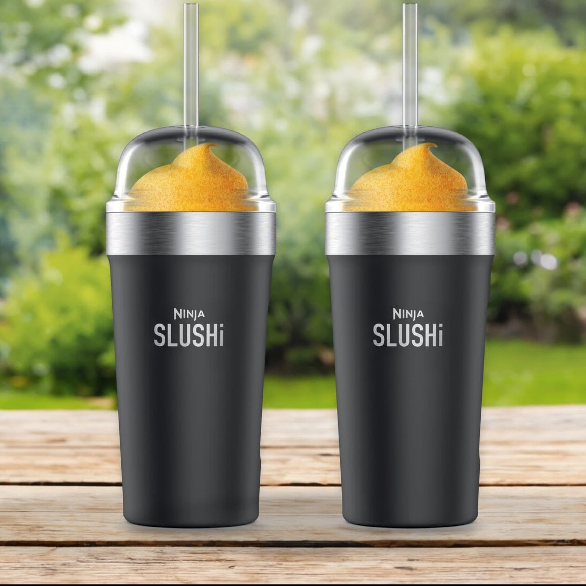 Two cups of slush on a garden table