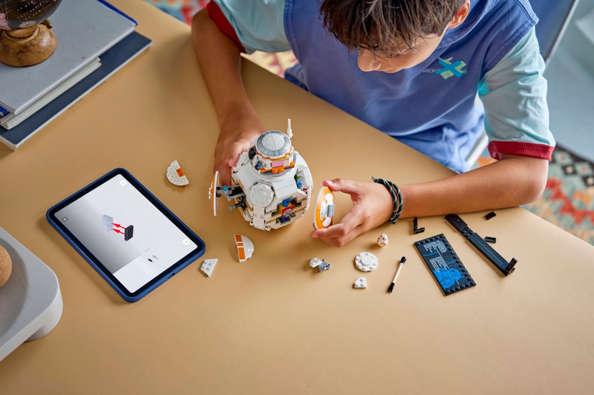 The droid BB-8 being built and played with