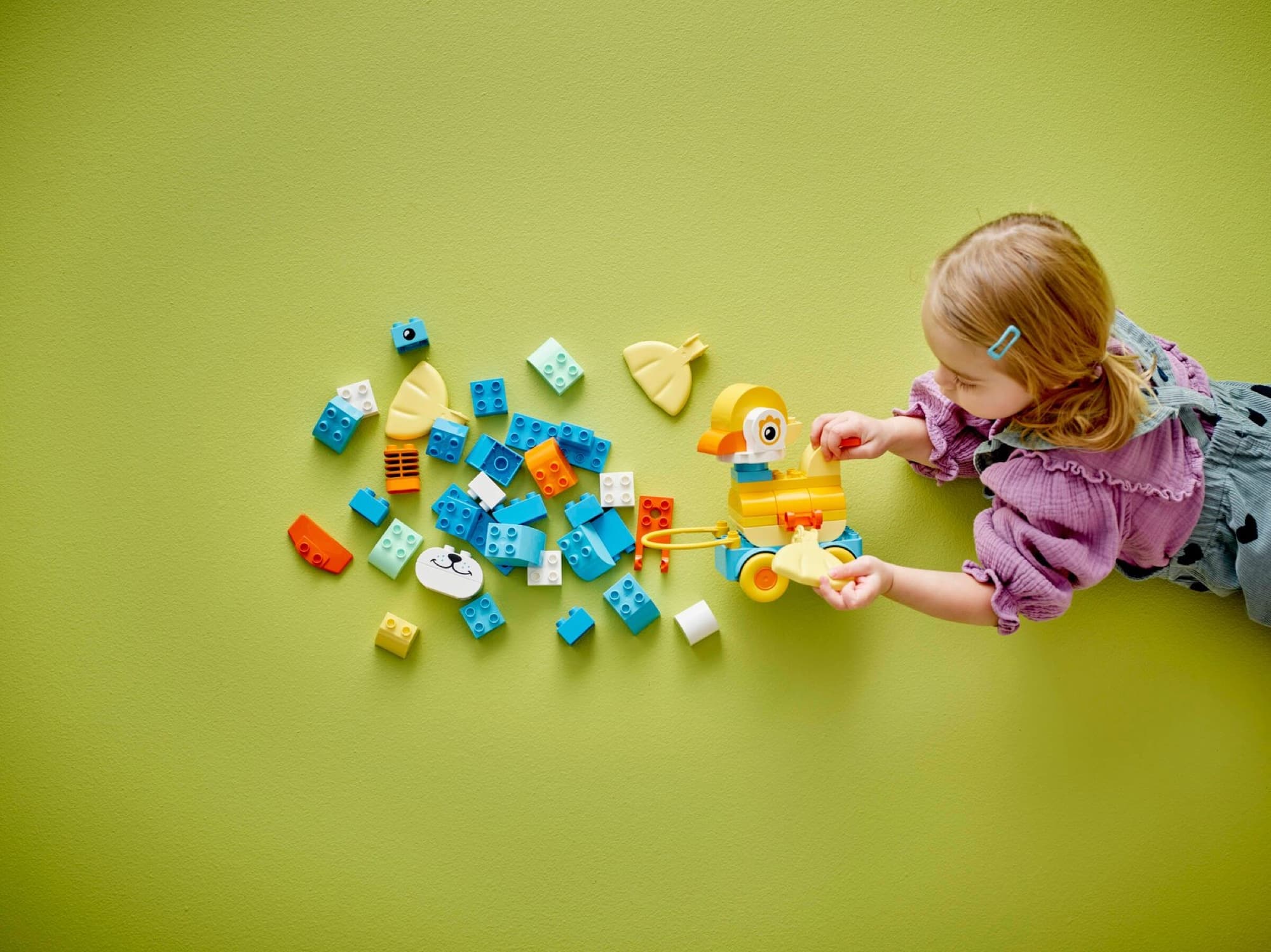 DUPLO animals on wheels being built and played with