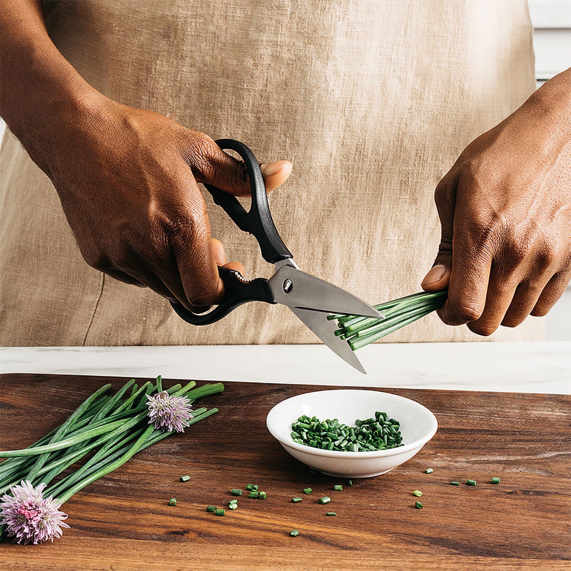 The scissors snipping chives