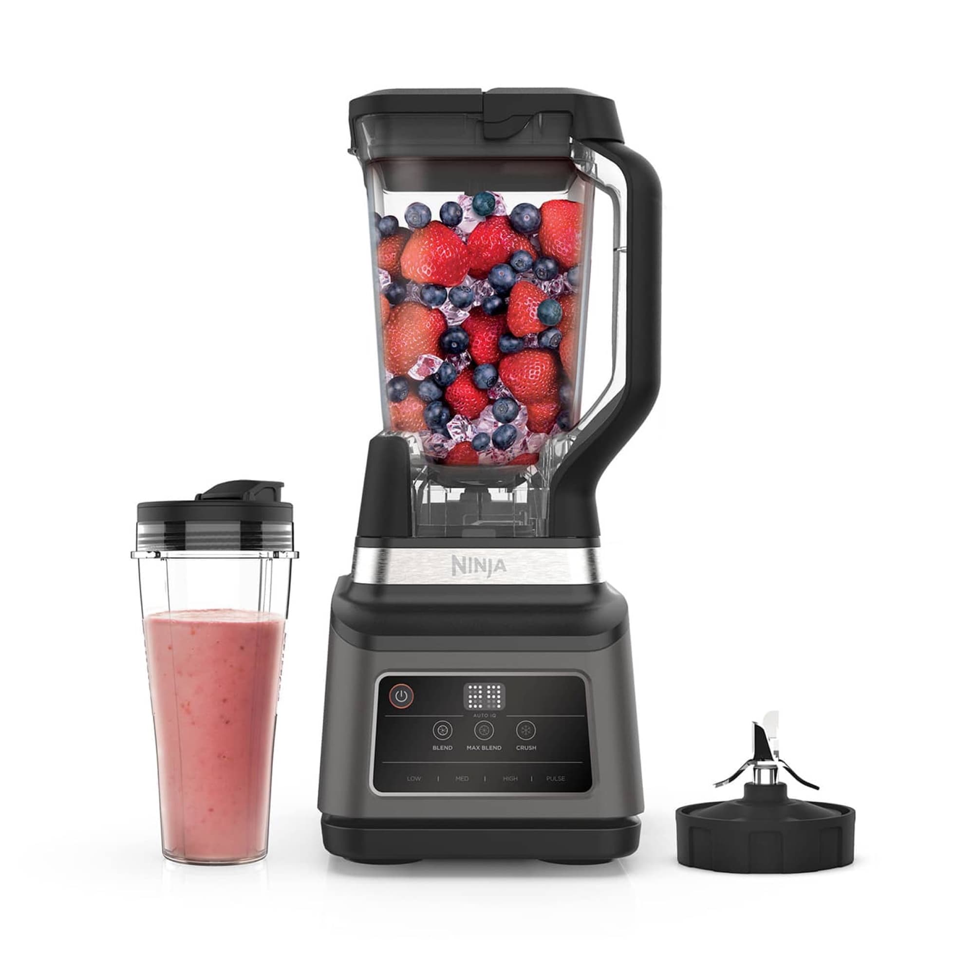 The blender with jug and a cup of smoothie