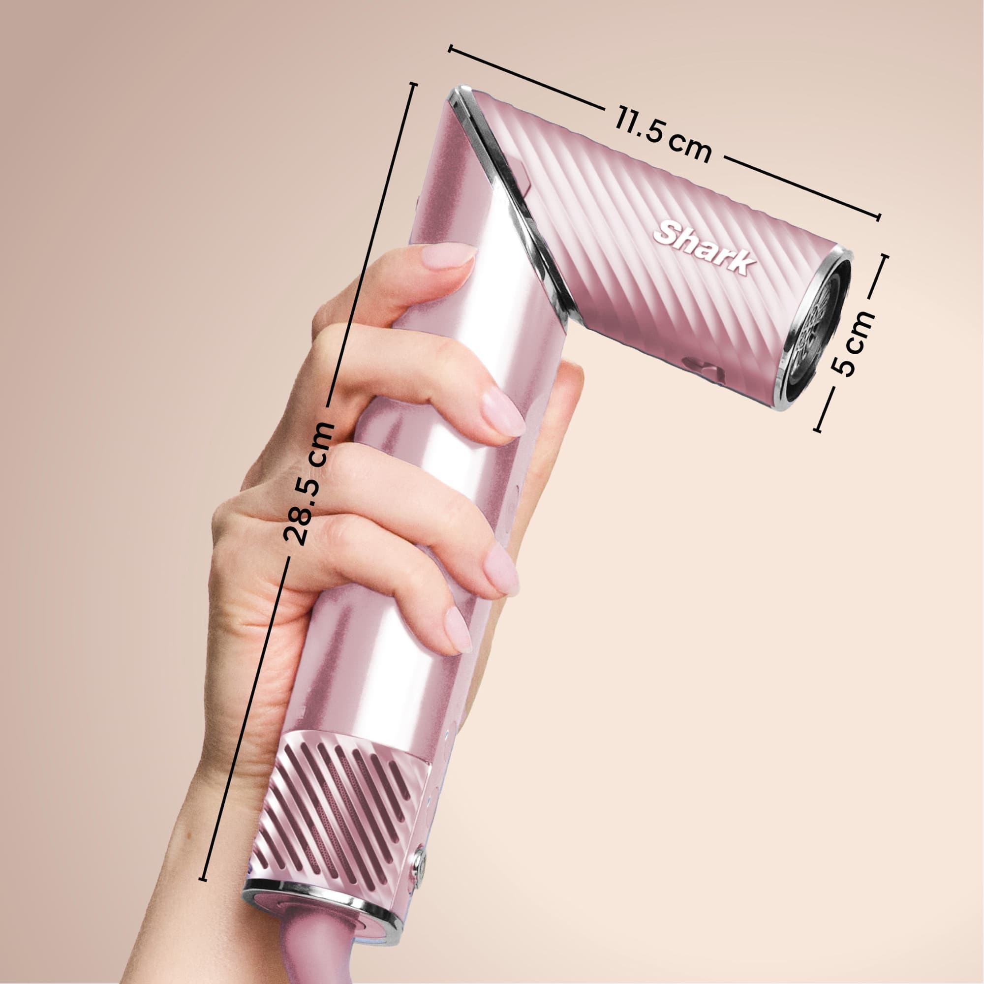 The dryer's dimensions: 28.5 cm handle and 11.5 × 5 cm head