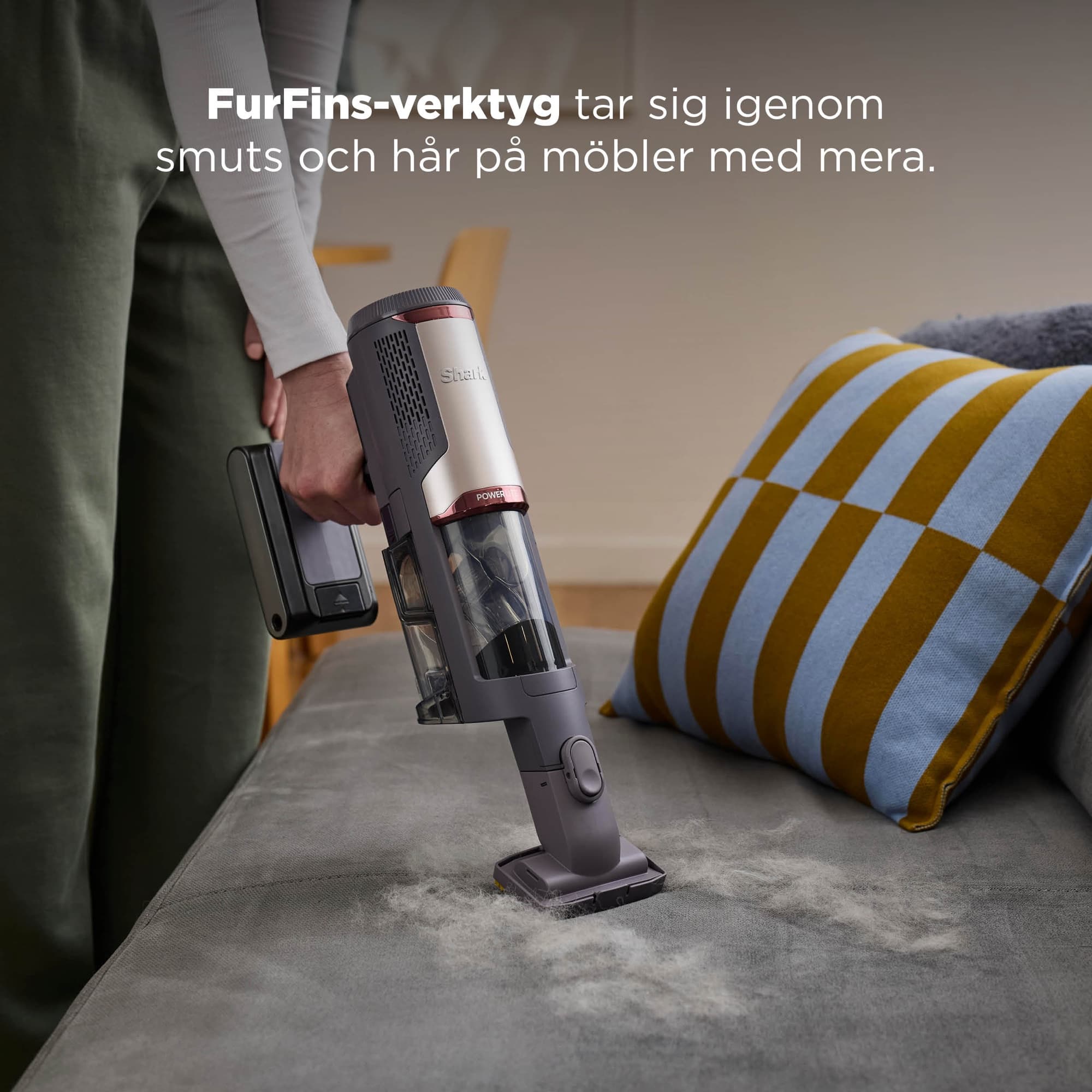 The FurFins tool taking hair off the sofa