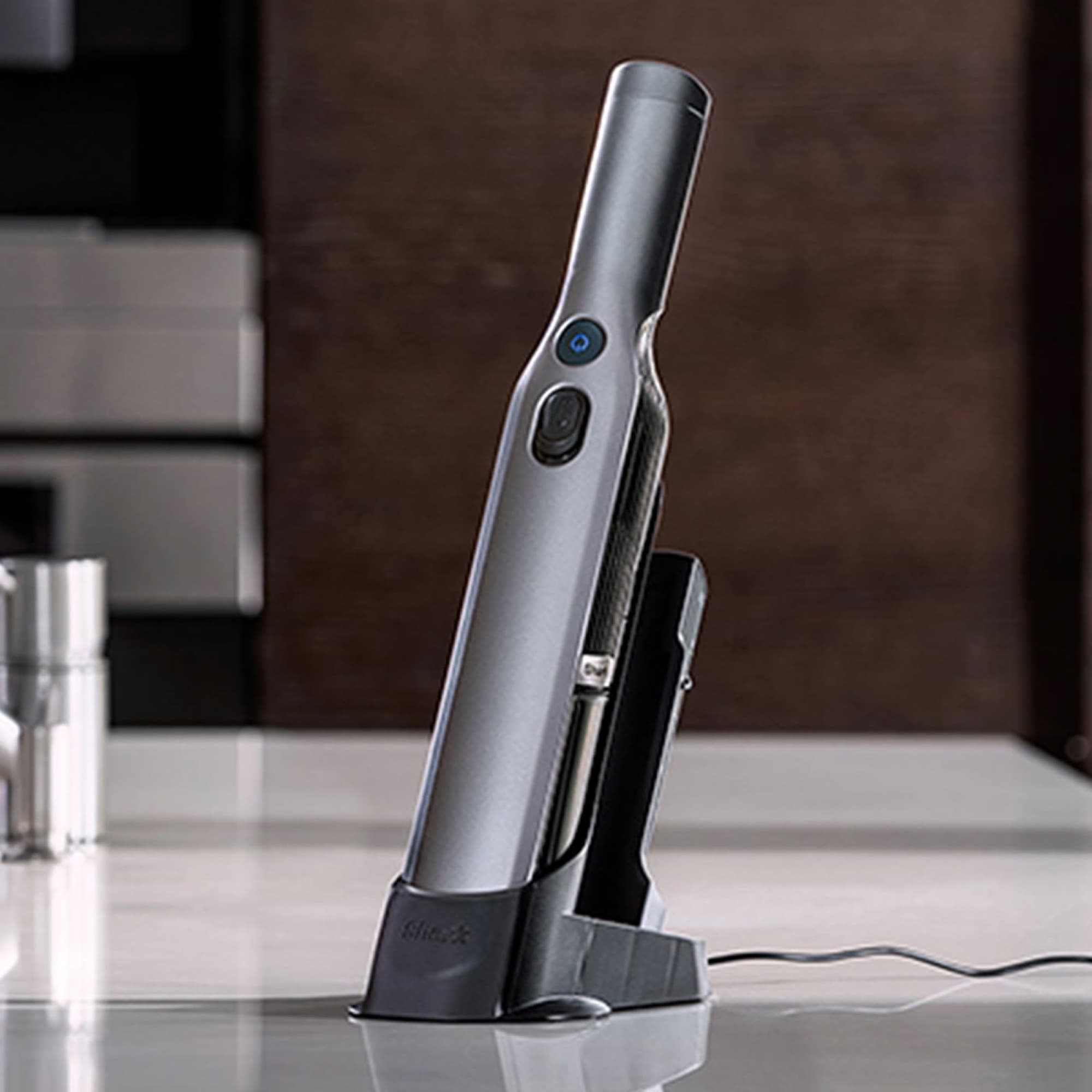 The WandVac charging on the kitchen counter